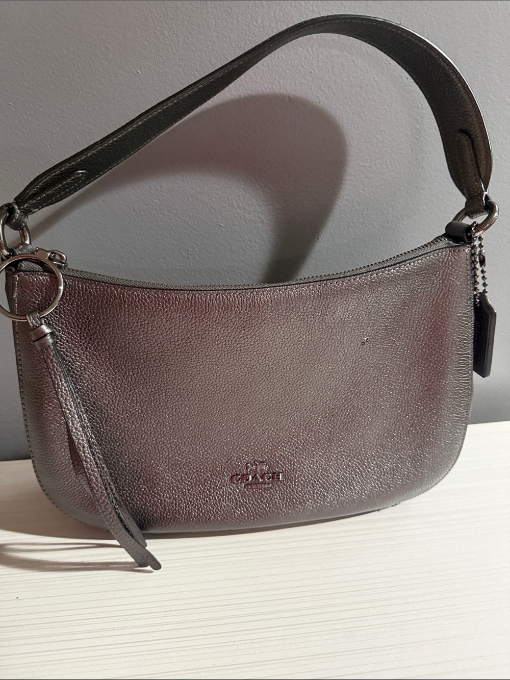 Coach Metallic Leather Chelsea shoulder bag in a polished silver-grey $370